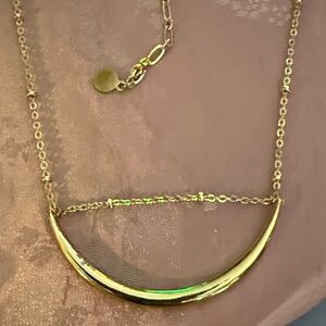 Gold tone half moon necklace about 22 inches long